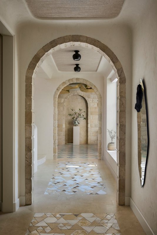 Arched stone hallway in the Los Angeles residence